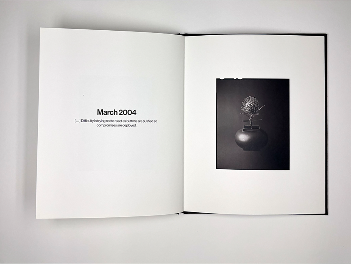 Photograph of flowers in a book with text