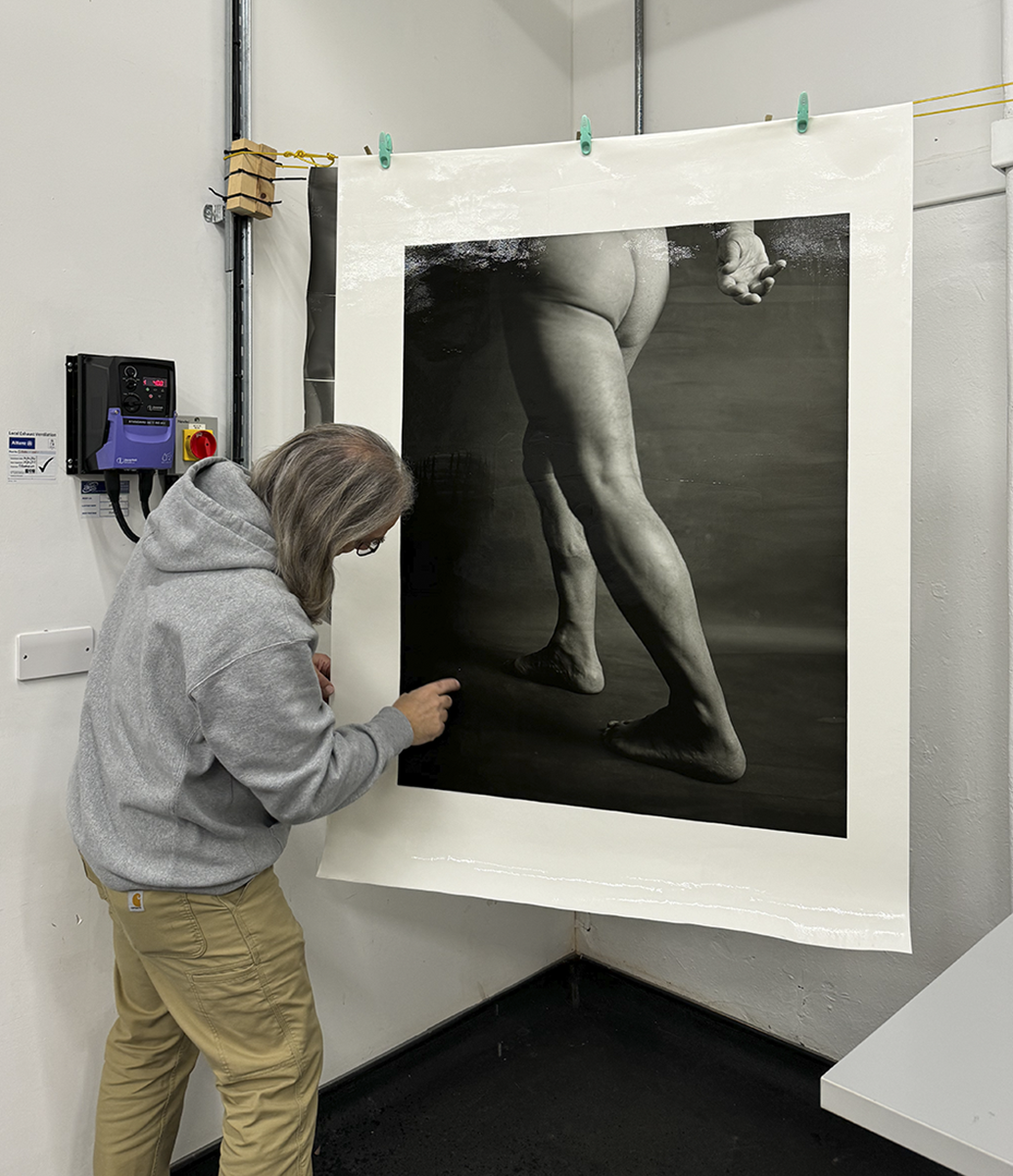 Man with a hanging photograph