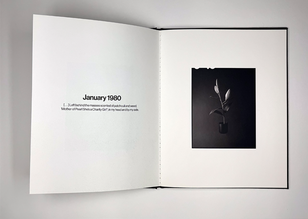 Photograph of flowers in a book with text