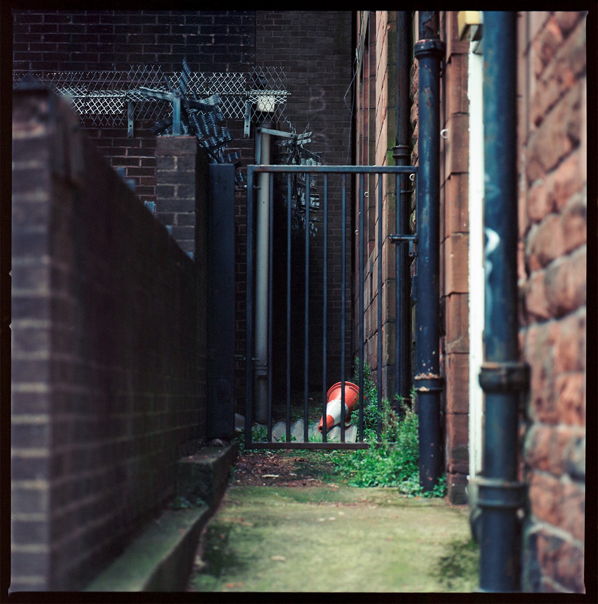 Road cone behind a gate