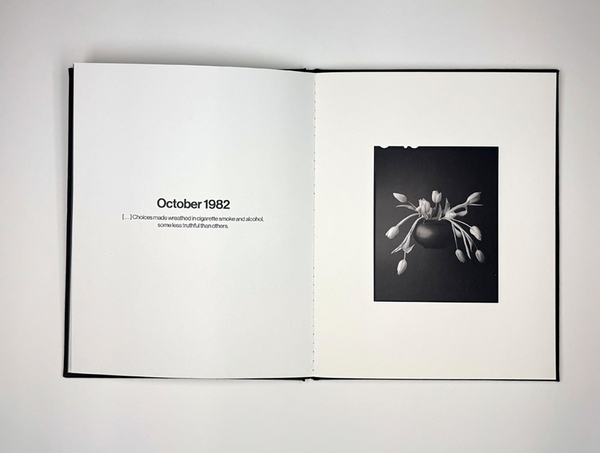 Photograph of flowers in a book with text